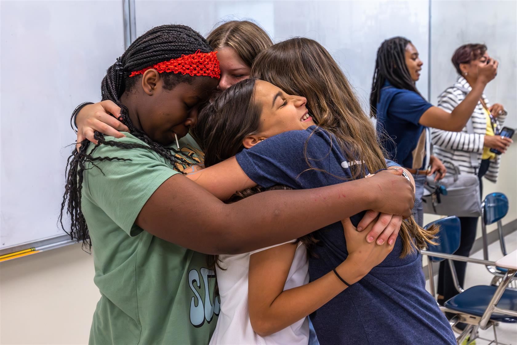 Guardrail 3 - Student Well-Being and Engagement | Image of group of students embracing each other